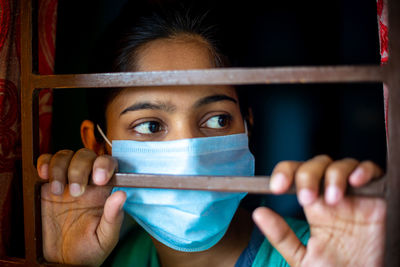 Close-up portrait of boy wearing mask