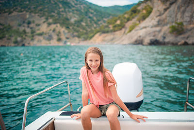 Portrait of woman sitting in boat