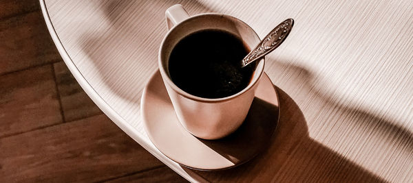 High angle view of coffee cup on table