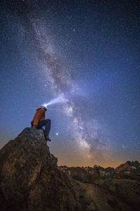 Scenic view of rock against sky at night