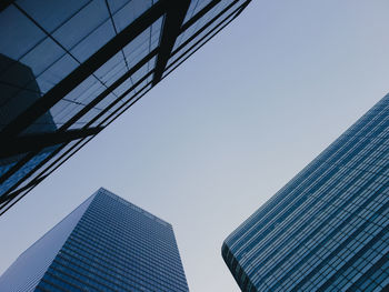 Low angle view of modern buildings against clear sky