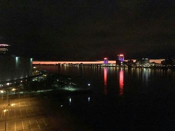 Reflection of illuminated buildings in water at night