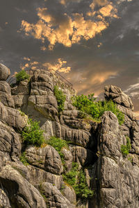 Rock formation on mountain against sky