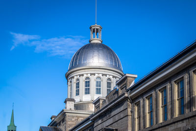 Low angle view of building against blue sky