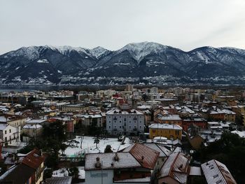 High angle view of houses and mountains against sky