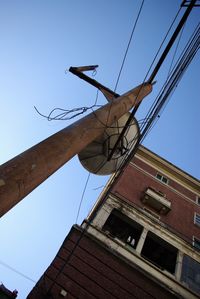 Low angle view of cables against blue sky