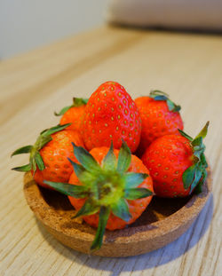 Close-up of strawberries in plate on table