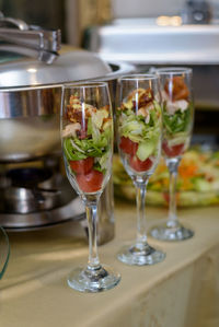 Close-up of wine glasses on table