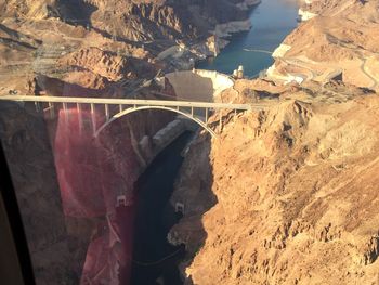 Aerial view of river passing through mountain