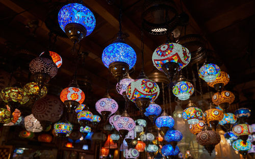 Low angle view of illuminated lanterns hanging in market