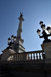 Low angle view of monument against clear blue sky