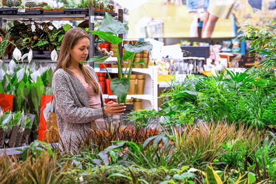 Woman standing at market stall