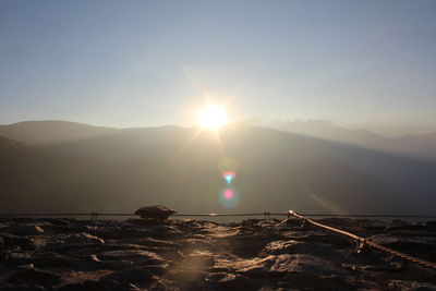Scenic view of mountain against sky during sunset