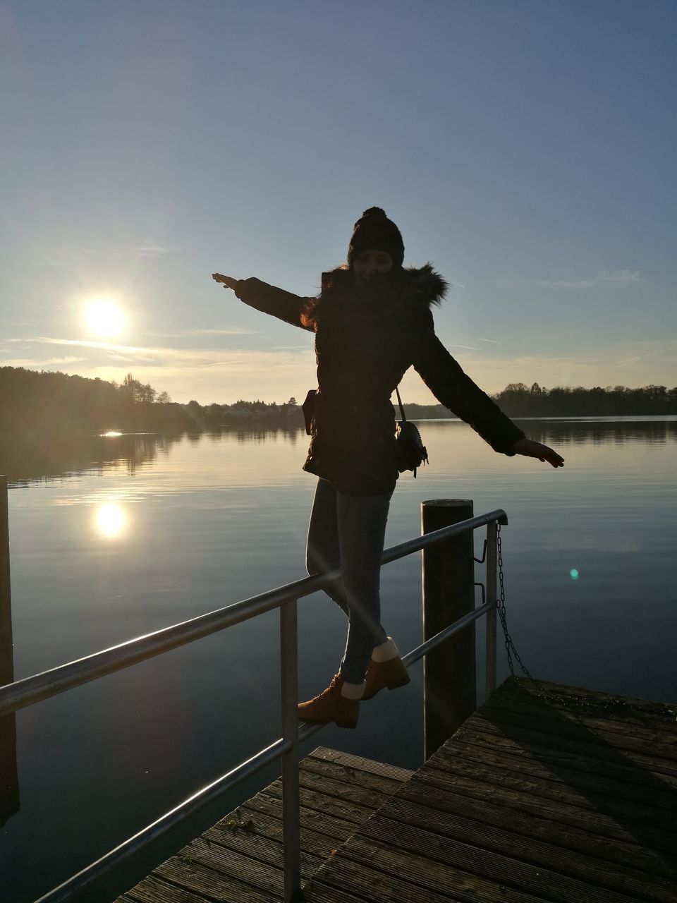 full length, railing, one person, standing, sky, rear view, water, outdoors, jumping, real people, sunset, sea, men, one man only, people, adults only, adult, only men, nature, day