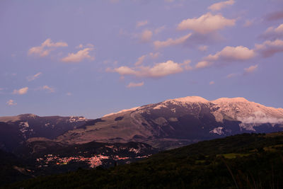 Scenic view of mountains against sky during sunset