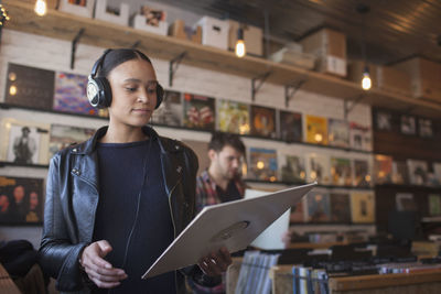 Young woman in a record store.