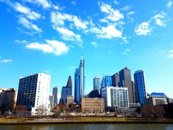 View of skyscrapers against blue sky