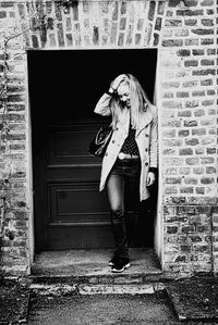 Woman standing in front of building