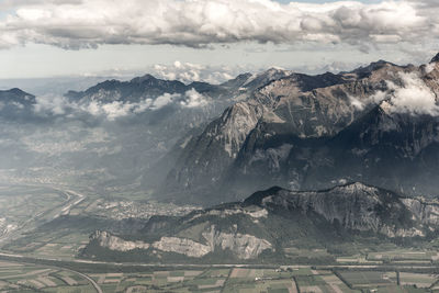 Aerial view of snowcapped mountains against sky