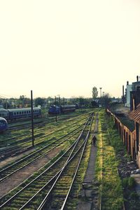 High angle view of railroad tracks in city against sky