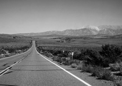 Road amidst landscape against clear sky