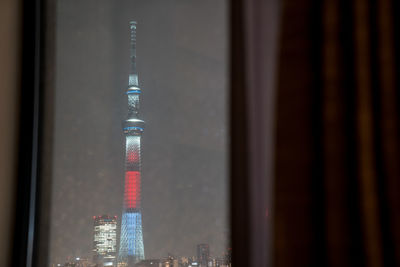 View of communications tower in city