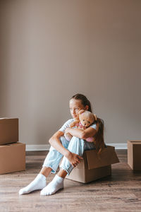 Portrait of woman sitting on sofa at home