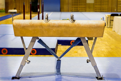 Close-up of empty chairs on table