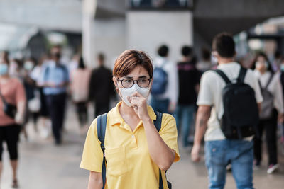 Woman with surgical mask in city