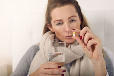 Close-up of woman holding medicine