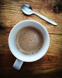 High angle view of coffee cup on table