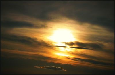 Low angle view of cloudy sky at sunset
