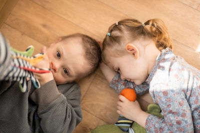 High angle view of cute girl eating apple