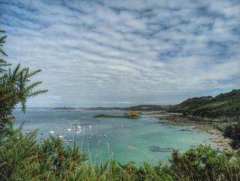 Scenic view of sea against cloudy sky