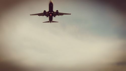 Low angle view of airplane against sky