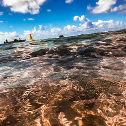 Scenic view of sea against cloudy sky
