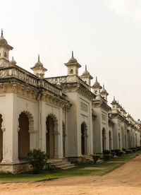 Facade of historic building against clear sky