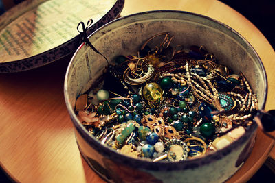 Close-up high angle view of jewelry in container