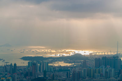 High angle view of buildings against sky during sunset