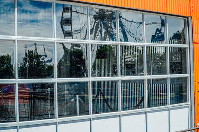 Reflection of building on glass window