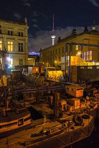 Commercial dock against buildings at night