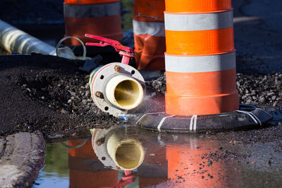 Water flowing from metal pipe at construction site