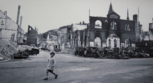 Full length of man walking on street against buildings in city