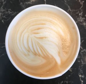 High angle view of cappuccino on table