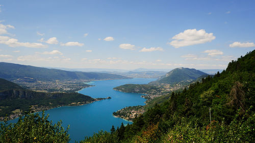 Scenic view of lake surrounded by hills