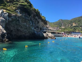 Scenic view of sea against clear blue sky