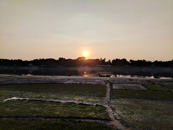 Scenic view of lake against sky during sunset