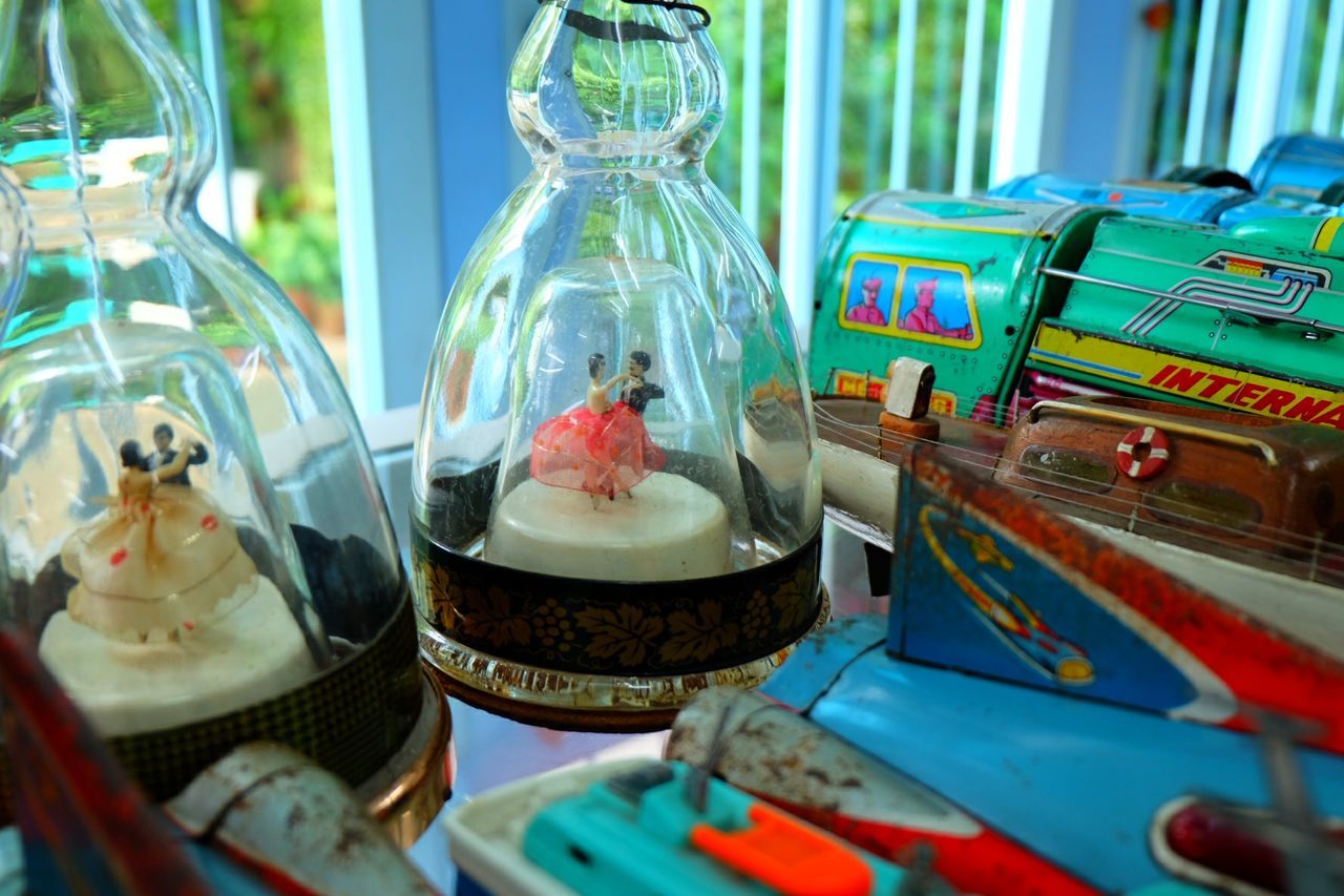 indoors, variation, multi colored, for sale, retail, still life, choice, close-up, display, focus on foreground, food and drink, large group of objects, selective focus, text, store, glass - material, no people, abundance, container, market stall