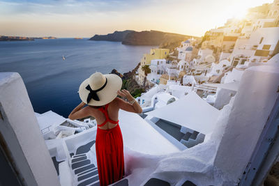 Panoramic view of sea and buildings against sky