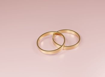 Close-up of wedding rings on table